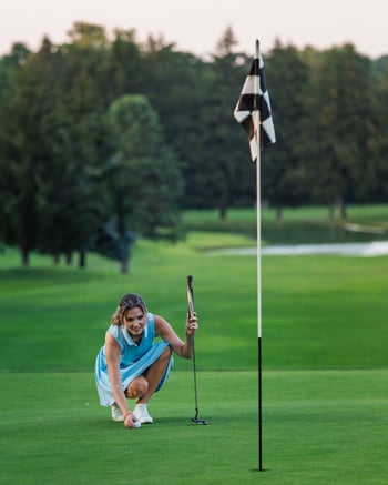 Blog_ The Quiet Revolution PHOTO 2 CAPTION_ Jillian lining up a putt on hole 9 at Flourtown Country Club